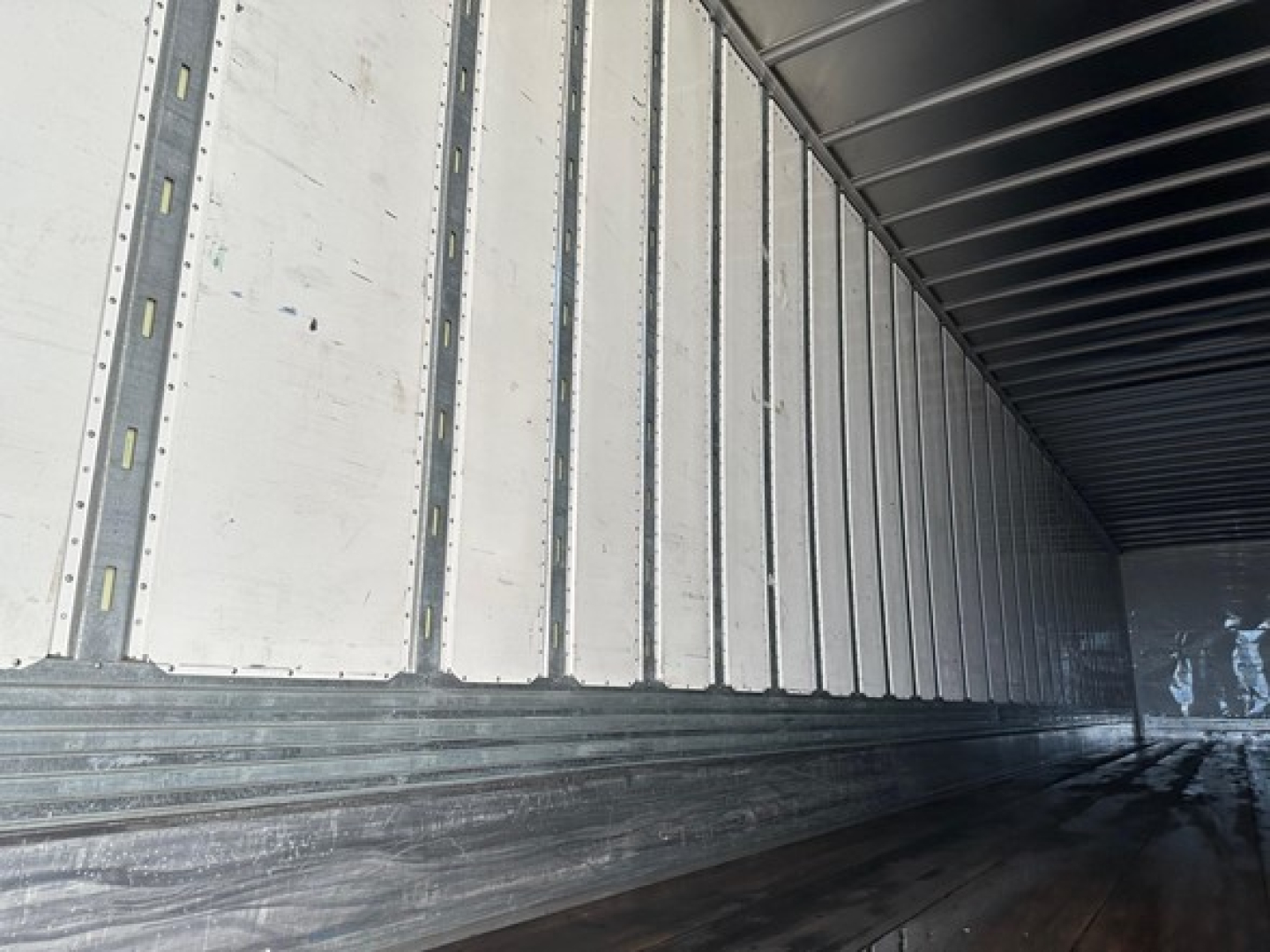 Trailer interior showing metal side walls and ribbed floor in a Utility 4000Dx trailer.