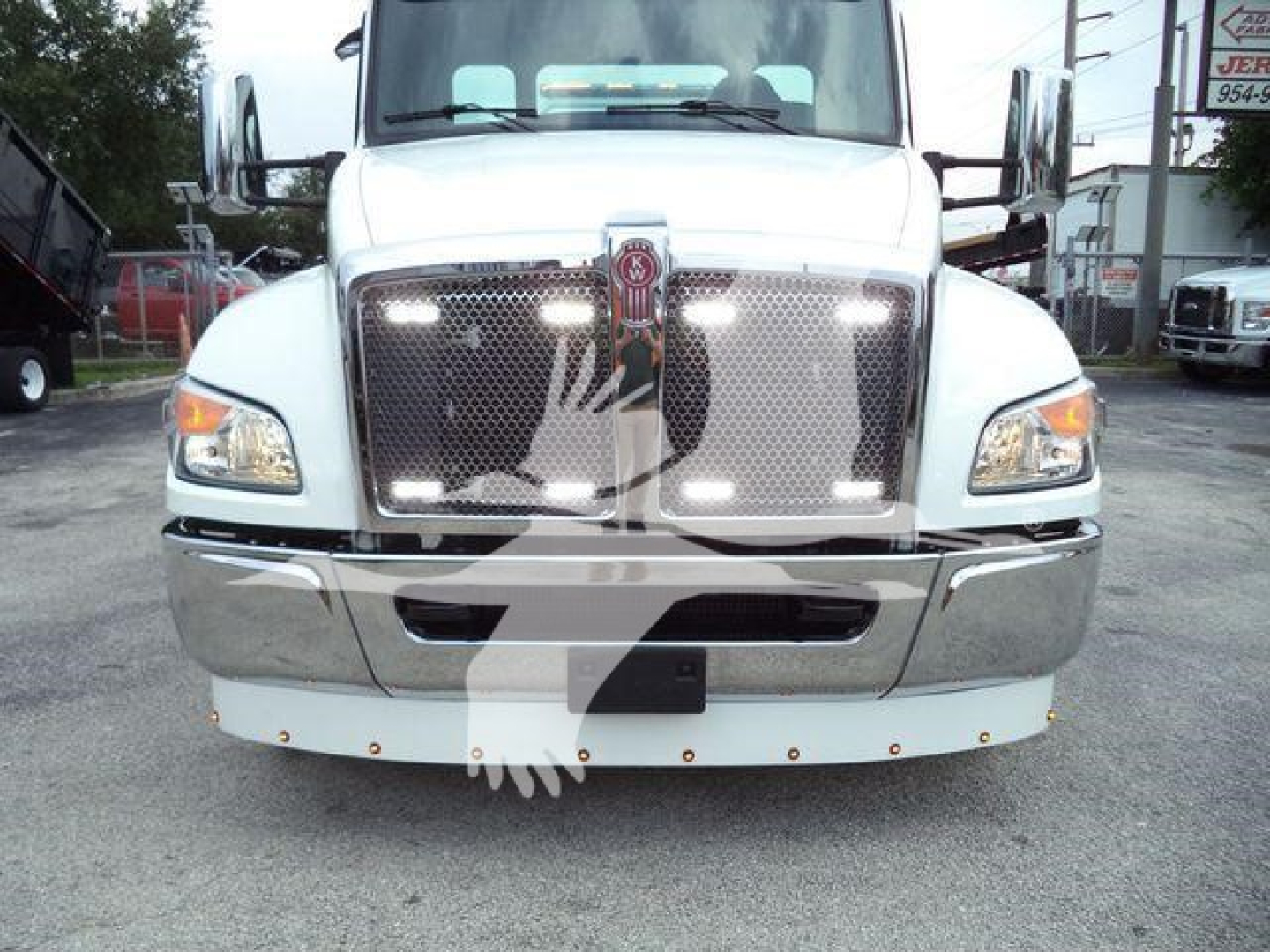 Front view of a white Kenworth T280 truck showing grille, headlights, and chrome bumper.
