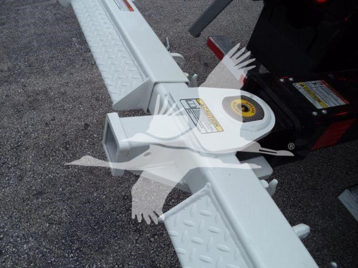 Kenworth T280 rollback stock image showing white aluminum wheel lift mechanism with diamond plate steps and warning labels.