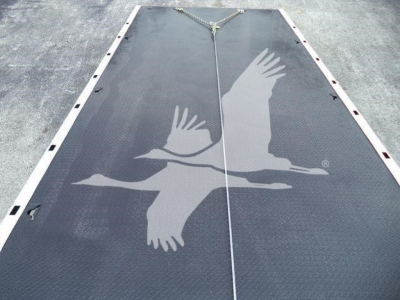 Kenworth T280 rollback bed showing steel diamond plate with a large eagle graphic and white frame along edges.