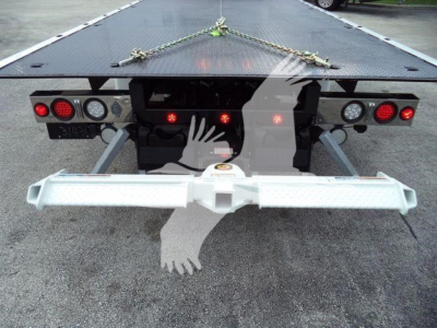 Rear view of a 2025 Kenworth T280 rollback truck flatbed with a chrome rear bumper and taillights visible.