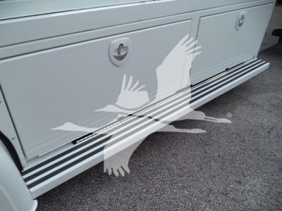 Kenworth T280 rollback truck side step with white paint and black striping, lower side panel view