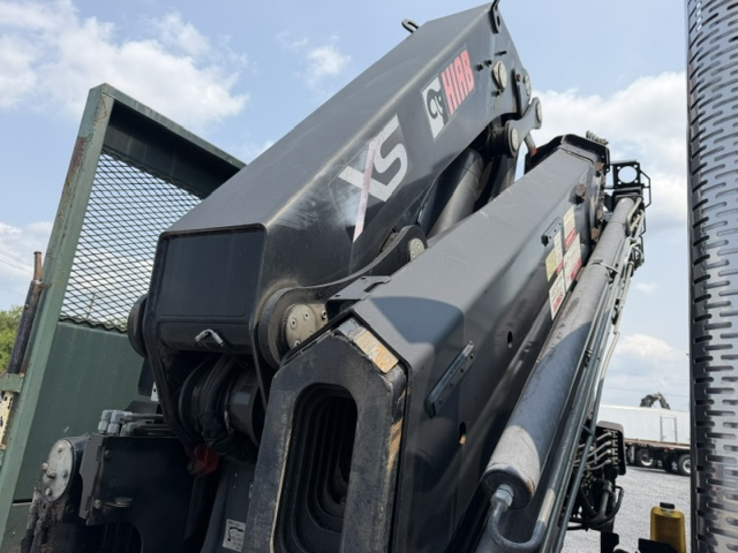 Crane-equipped 2022 International 7600 SBA Work Star truck in a used condition, with a jib crane folded and side panels visible.