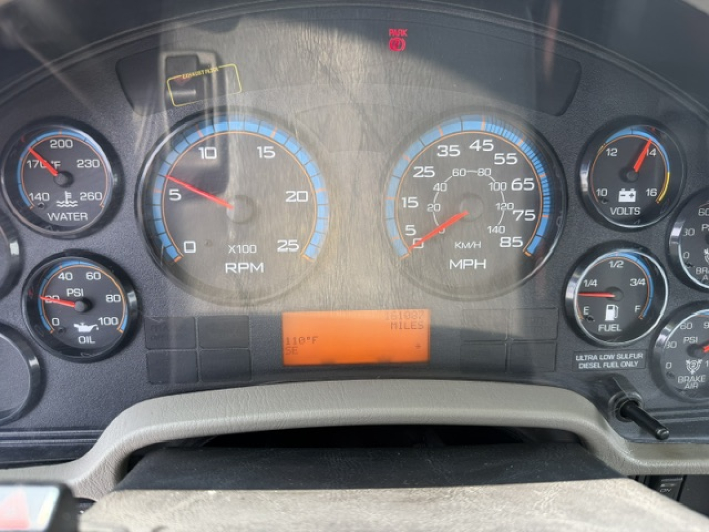 Dashboard gauges of a 2022 International 7600 SBA Work Star showing RPM, speed, and auxiliary gauges in a work truck cab.