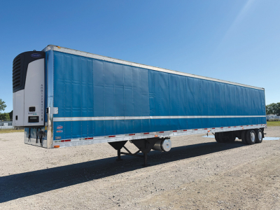 Trailer side view showing a blue 2012 Utility 3000R refrigerated trailer with white lower side rails and white refrigeration unit at front left.