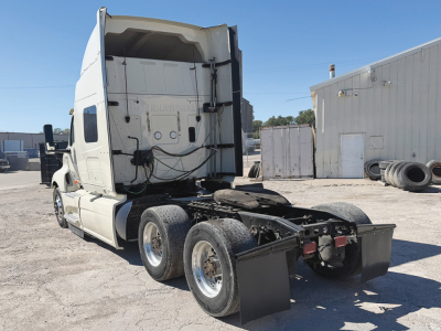 Truck cab and chassis of a 2022 International LT625 conventional sleeper, rear view showing dual rear axles, fifth-wheel area, and mud flaps.