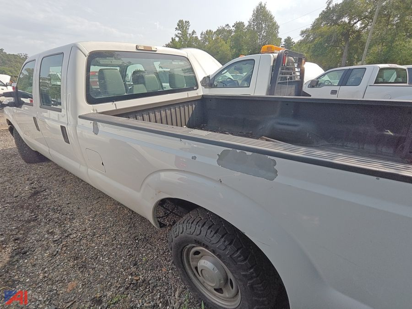 Ford F-250 Super Duty crew cab pickup truck in a used condition with a long truck bed.