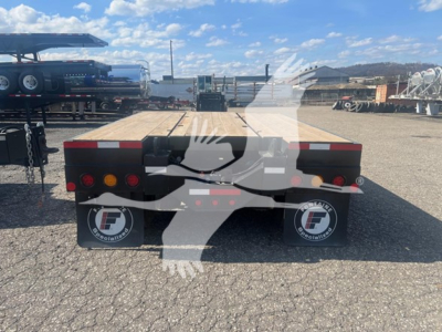  Fontaine Paver Pro lowboy trailer rear view showing taillights and mud flaps with Fontaine logo and spare wheels.