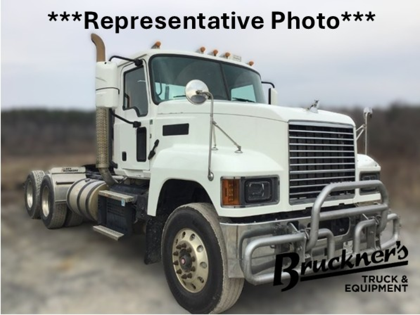 Truck image showing a white 2020 Mack PI64T in-service daycab with front grille, bumper guard, and wheels; Bruckner's Truck & Equipment watermark.