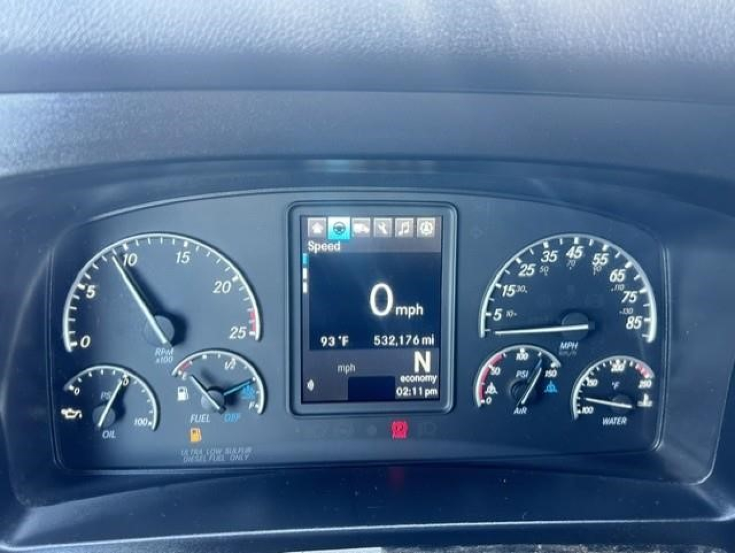 Truck dashboard showing digital display with 0 mph, temperature 93°F, 532,176 miles, gear N, and various gauges including oil, fuel, and water.