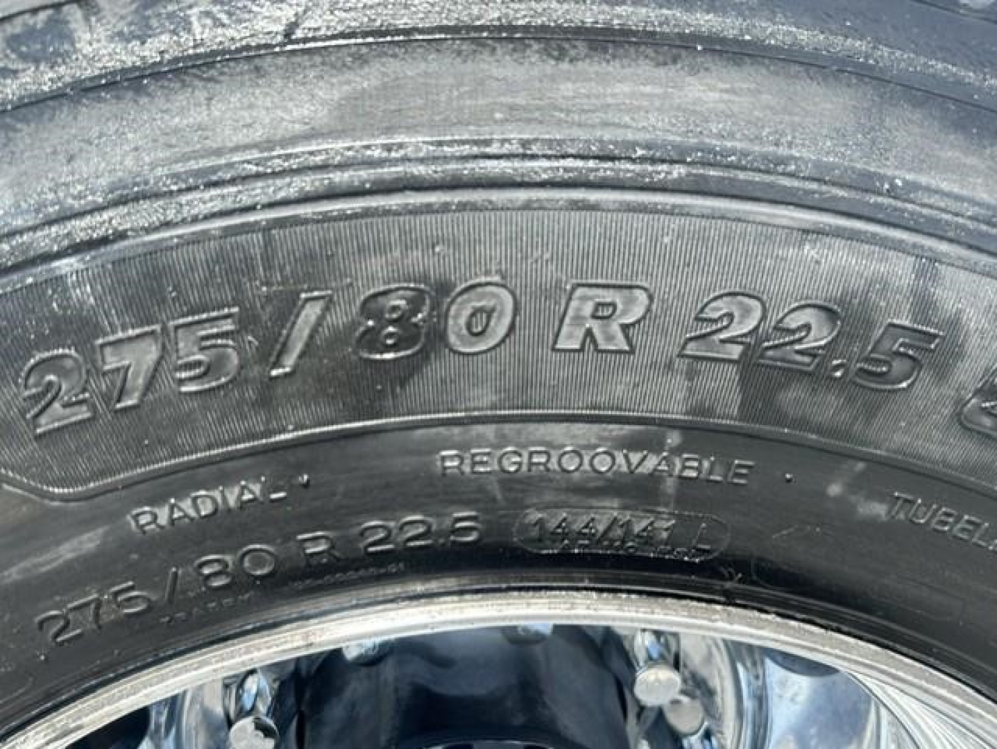 Tire sidewall showing 275/80 R 22.5 tire size and radial lettering visible