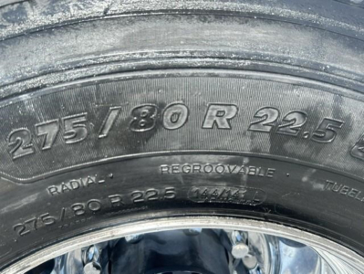Tire sidewall showing 275/80 R 22.5 tire size and radial lettering visible