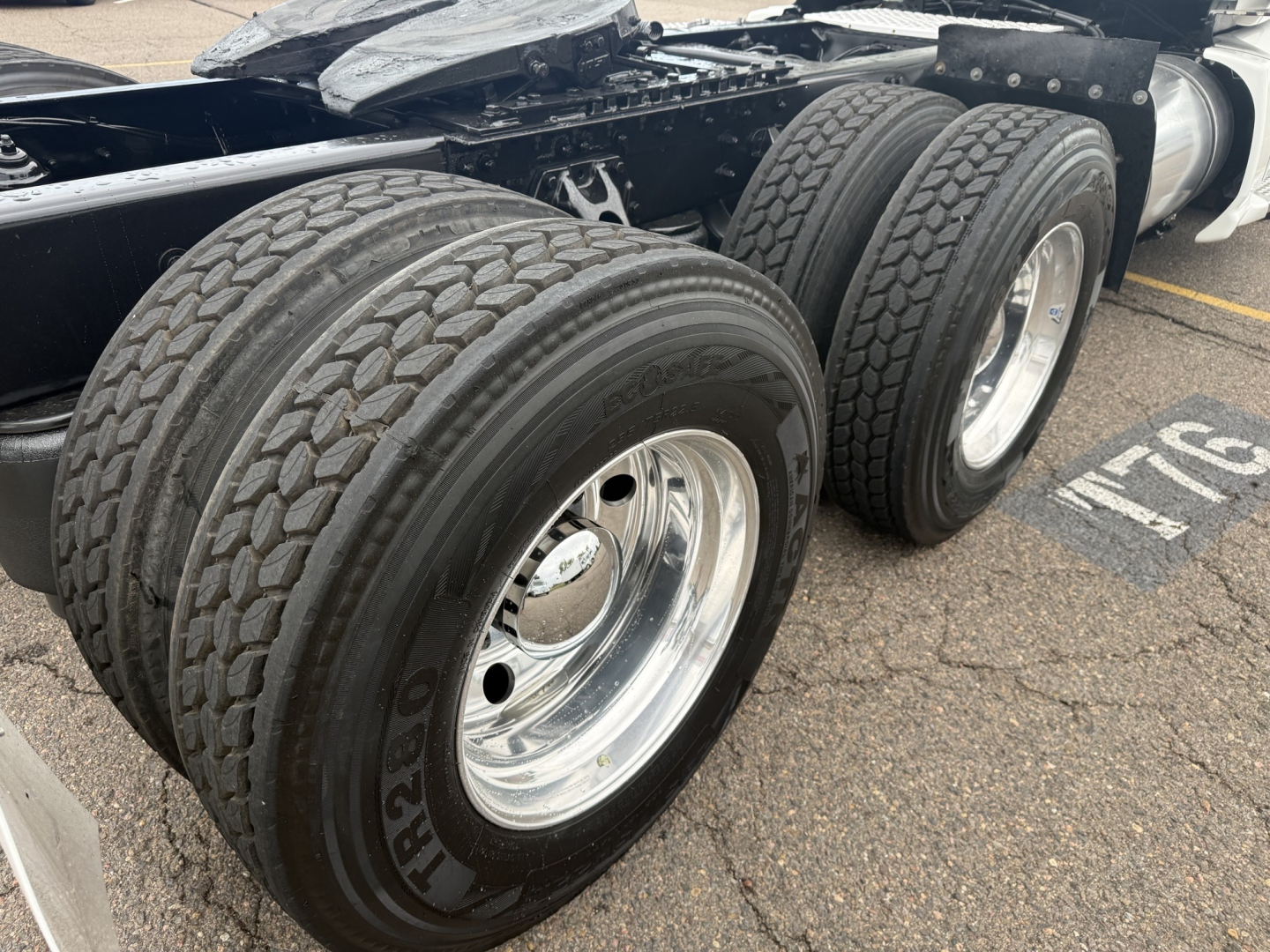 Kenworth T680 2020 wheelset close-up showing dual rear tires and chrome rims attached to a conventional daycab tractor chassis.