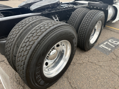 Kenworth T680 2020 wheelset close-up showing dual rear tires and chrome rims attached to a conventional daycab tractor chassis.