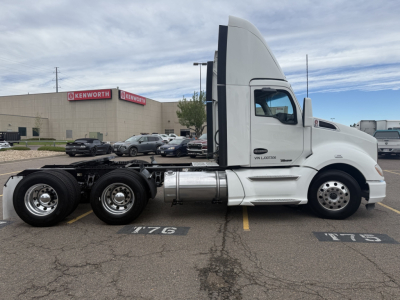 Kenworth T680 truck side view showing cab and chassis with 6 wheels, white exterior, fuel tank, exhaust stack. Visible text on cab includes VIN plate area and model badge.