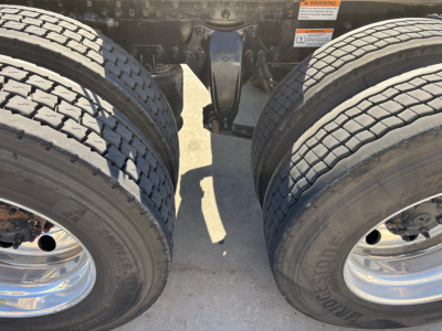 Freightliner PT126064ST rear chassis and dual rear axles showing tires and suspension components.