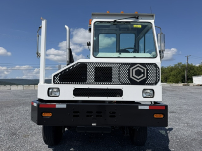Front view of a white Capacity Sabre DOT yard truck showing grille, cab, and bumper.