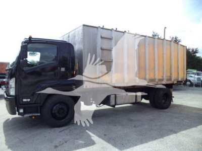 Isuzu FTR/dump truck side view showing cargo bed and cab with black exterior, tire details visible.