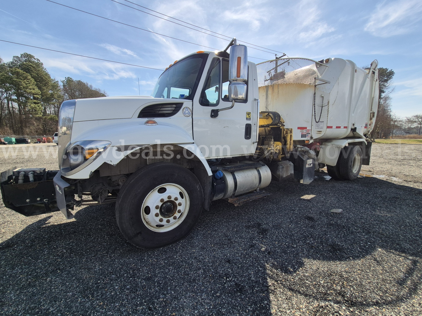 2017 International 7400 dump truck in service showing VIN 3HAWCSTR2HL167753 and stock number 2118-423 with a white cab and dump bed.