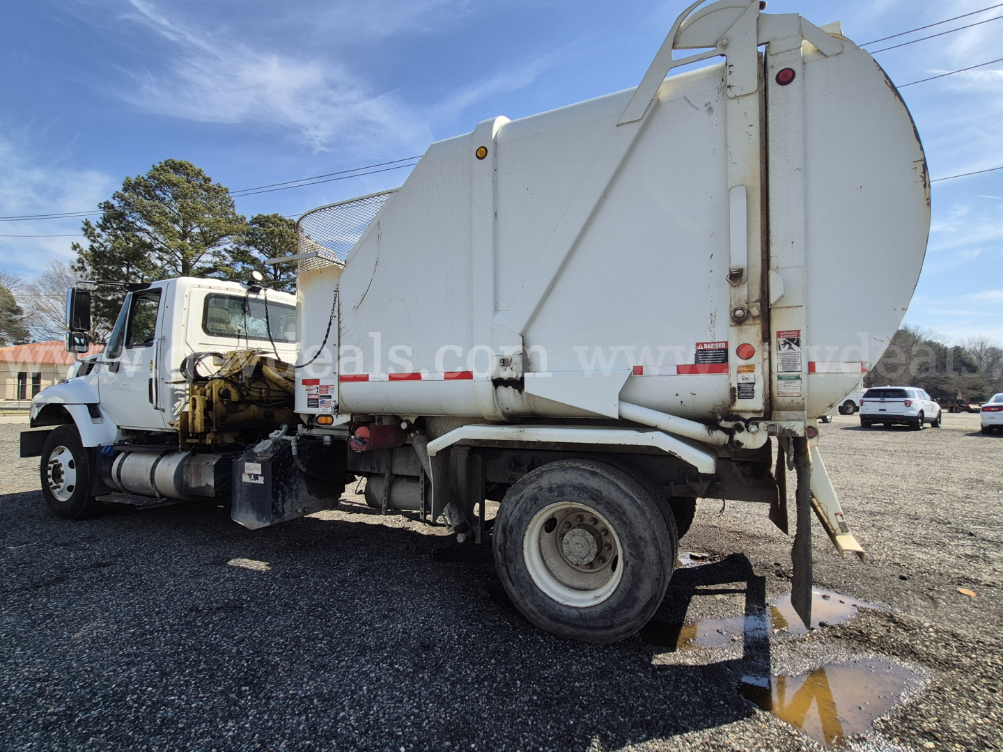 2017 International 7400 truck with waste tank showing rear and side view.