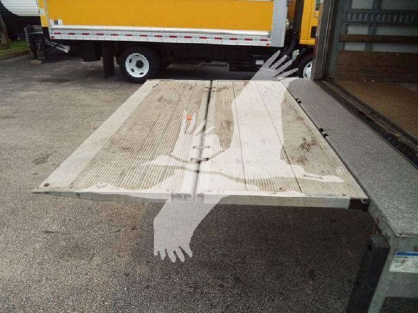 Flatbed truck with ramp, Isuzu NPR HD 2019 listing context text visible: VIN 54DC4W1B2KS802668, stock T02668, box truck category, used status.