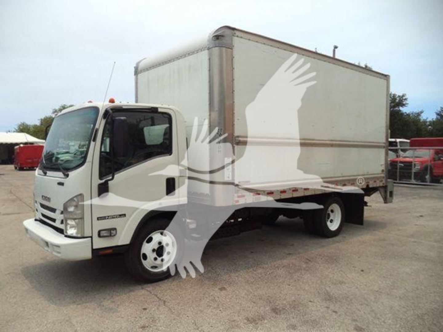 Isuzu NPR HD box truck viewed from front-left showing cargo box and cab.