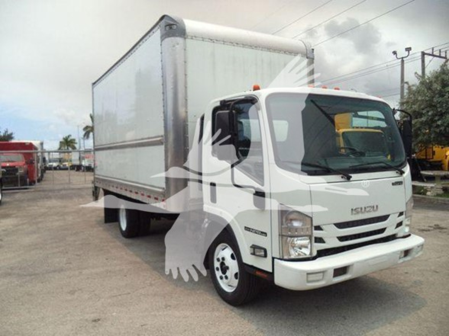 Isuzu NPR HD box truck showing side view with cargo box and cab, front-right angle.