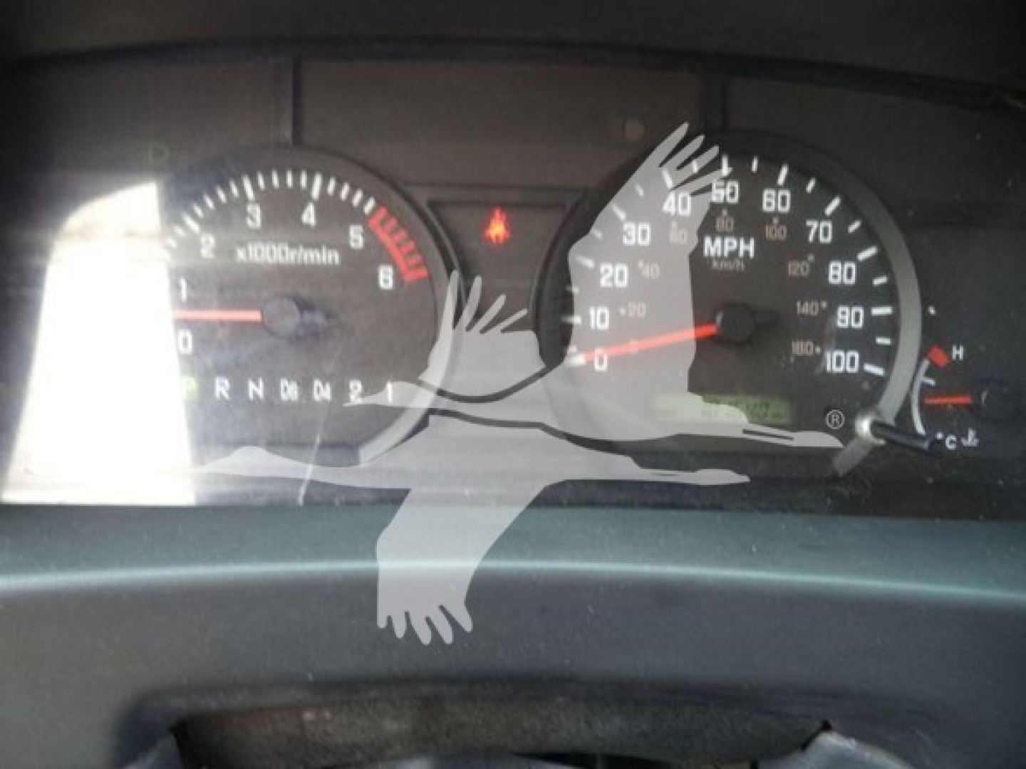 Isuzu NPR HD dashboard view showing speedometer and tachometer gauges with warning light indicators.