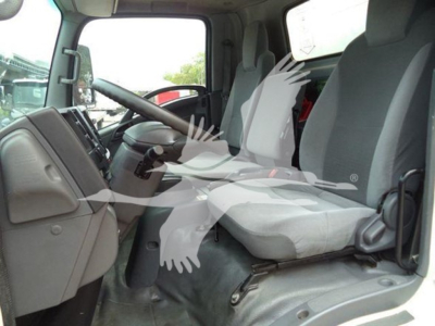 Isuzu NPR-HD truck cab interior with driver seat and passenger seat visible.