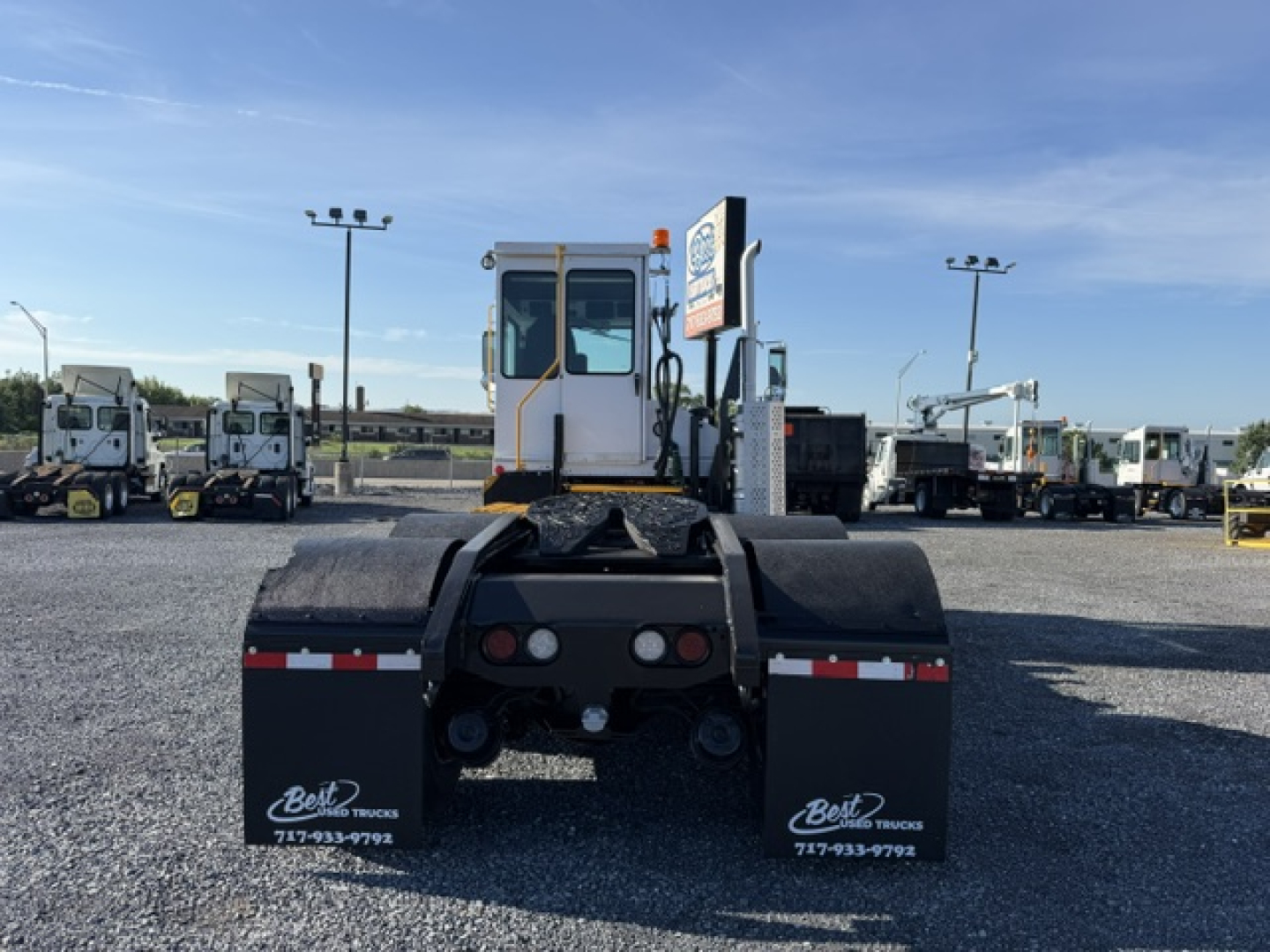 Capacity TJ6500 DOT yard truck rear view showing mud flaps, chassis, and rear hitch area.