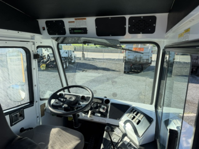 Cab interior of a 2019 Capacity TJ6500 yard truck showing steering wheel, dashboard, gauges, and overhead panels.