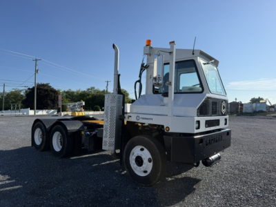 Capacity TJ6500 DOT truck showing cab and chassis with white body, visible exhaust stack, and front bumper; no legible model text on image.