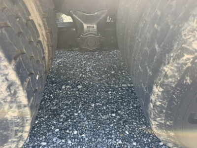 TJ6500 Capacity showing hitch area between dual rear wheels with chassis view and label