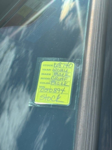 Stock sticker on Mack truck window showing stock number 68740 and VIN 1M2GR4GC1TM050894.