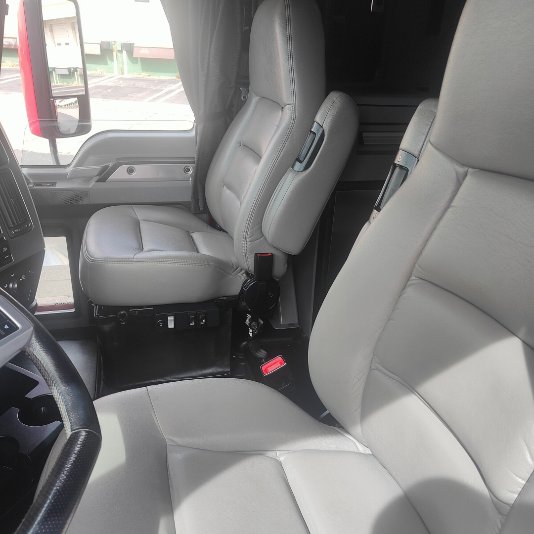 Cab interior of a 2022 Mack AN64T70 truck showing front seats and cabin area.