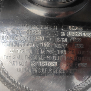 Tank information plate showing MFG date, serial, total liquid capacity, usable liquid capacity, warning text, and Ultra Low Sulfur Diesel Fuel labeling.