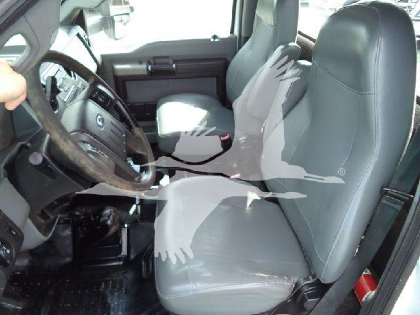 Ford F-650 XL SD interior showing front seats and steering wheel