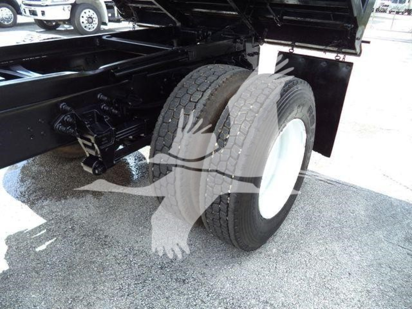 Ford F650 XL SD dump truck rear wheel and suspension visible