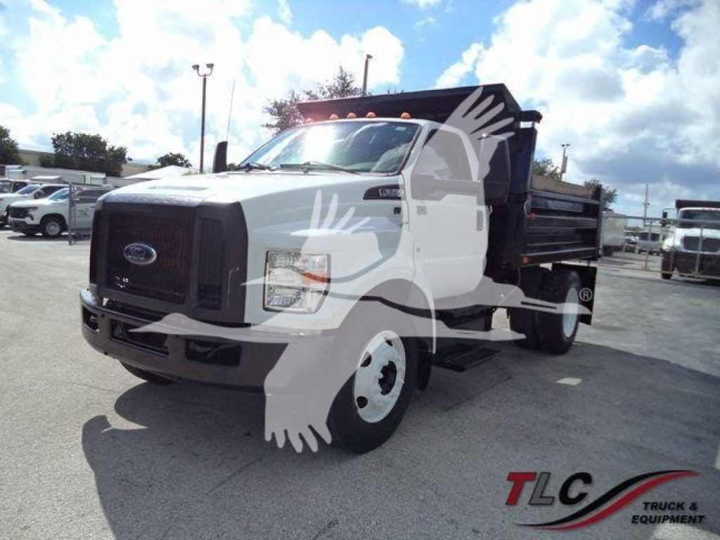 Ford F-Series dump truck, white cab, black grille, front bumper, 2017 Ford F-650 XL SD with dump bed. Vehicle shown from front-left angle in lot.