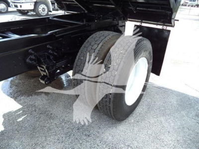 Ford F650 XL SD dump truck rear wheel and suspension visible