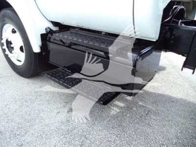 Truck side view showing black rectangular side step and underbody storage box on 2017 Ford F650 XL SD dump truck.