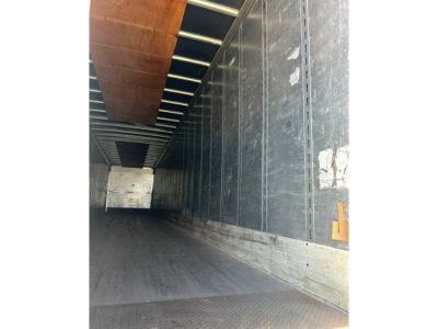 Interior of a Great Dane P-Series trailer trailer bed showing metal walls and empty loading area.