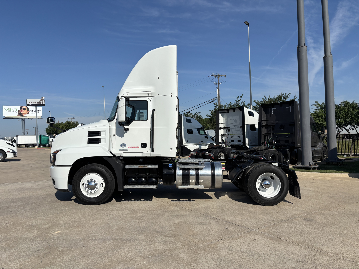 Mack AN42T daycab tractor in side view showing cab, fuel tanks, and chassis without trailer.