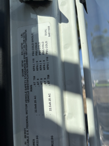 Label on Mack AN42T showing vehicle specifications including GVWR, axle ratings, and cold start data with vertical orientation.