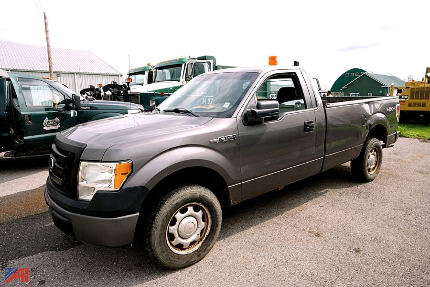 Ford F-150 pickup truck a side view showing extended cab in gray with Silverado-like bumper and SHD wheel; 2010 model year implied.