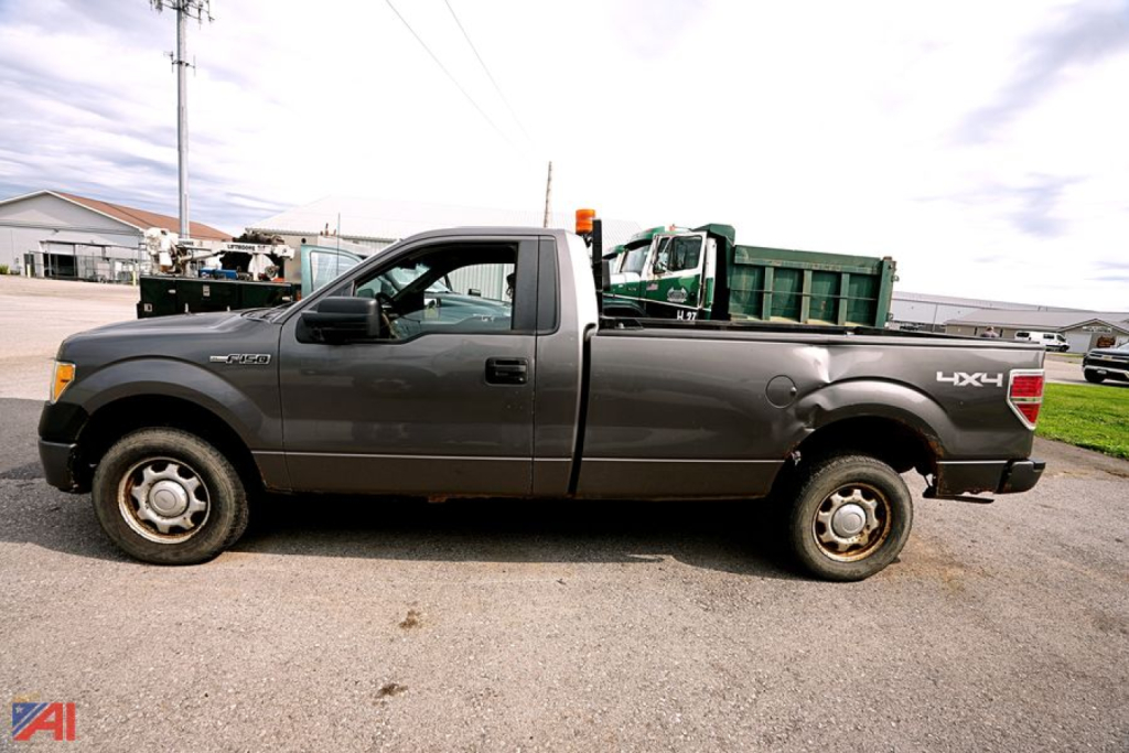 Ford F-150 pickup truck side view with long bed and utility truck bed in gray color