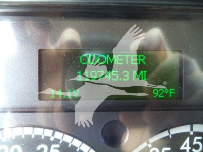 Glovebox display showing odometer 109745.3 MI and 92°F with fuel level 14% in Freightliner M2 106 truck interior photo.