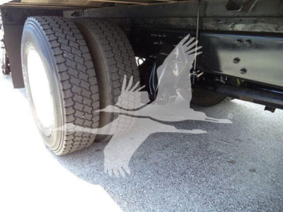 Freightliner M2 106 rear dual wheels and chassis frame showing tire tread and undercarriage components.