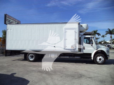 Freightliner Business Class M2 106 refrigerated truck side view showing cargo box and cab with white exterior.