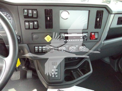 Dashboard area of 2025 Kenworth T280 cab showing controls, touchscreen display, vents, and storage compartments.